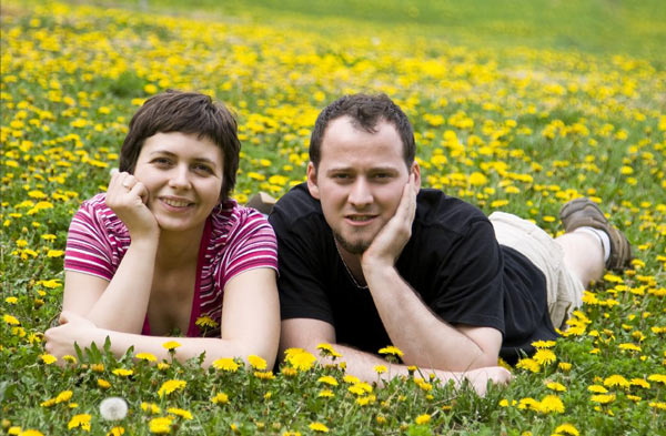 Man and woman lying in grass