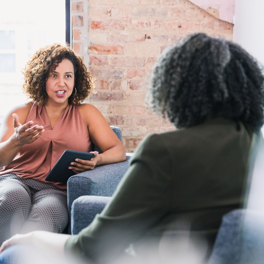 Therapist noting patient speech during personal session Top 5